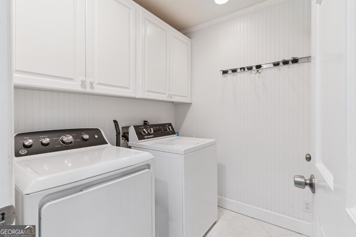 311 Dunbarton Drive St. Simons, GA 31522 - Photo 23 of 44 a utility room with dryer and washer