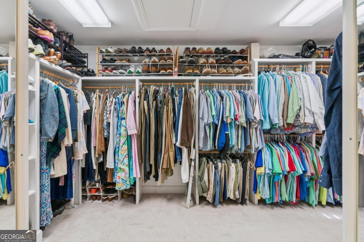 311 Dunbarton Drive St. Simons, GA 31522 - Photo 30 of 44 a view of walk in closet with clothes