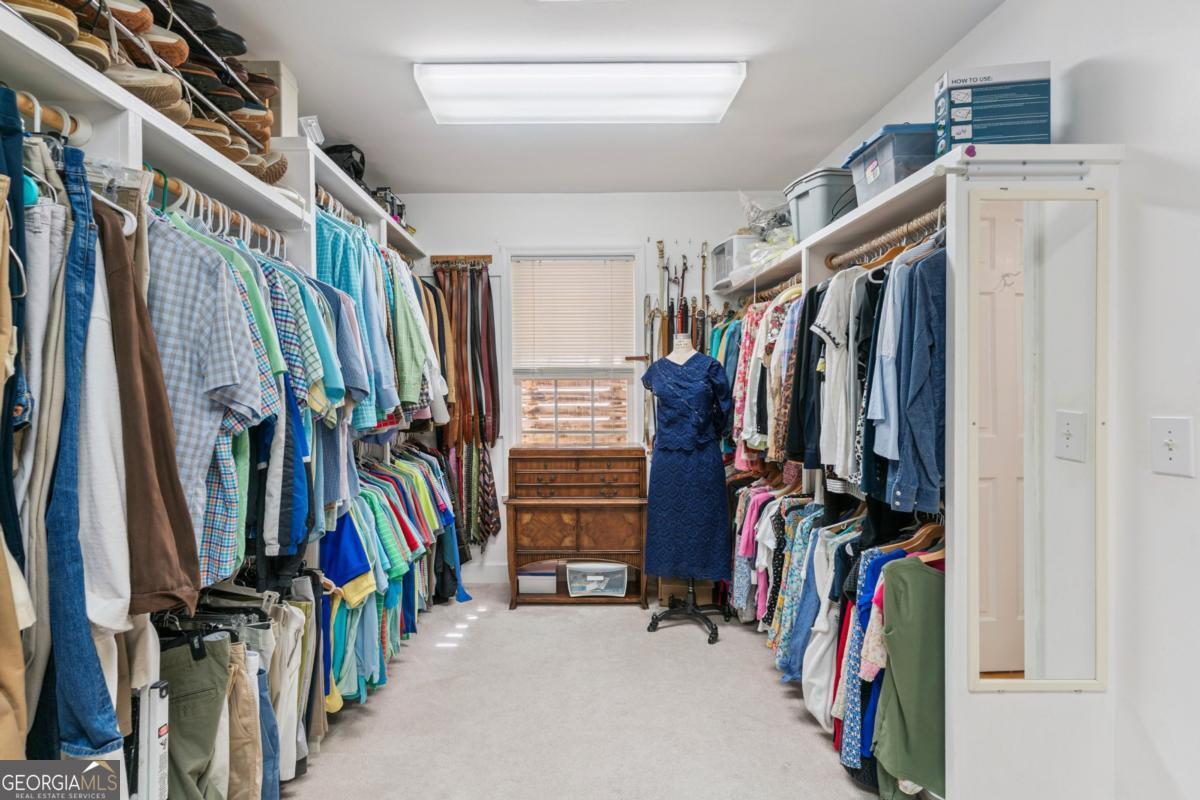311 Dunbarton Drive St. Simons, GA 31522 - Photo 31 of 44 a view of walk in closet with clothes