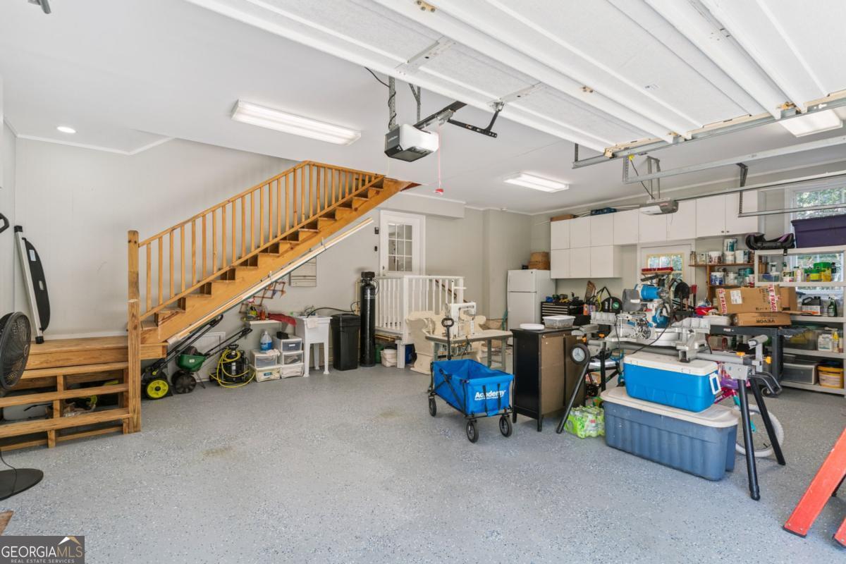 311 Dunbarton Drive St. Simons, GA 31522 - Photo 37 of 44 a living room with lots of furniture and white walls
