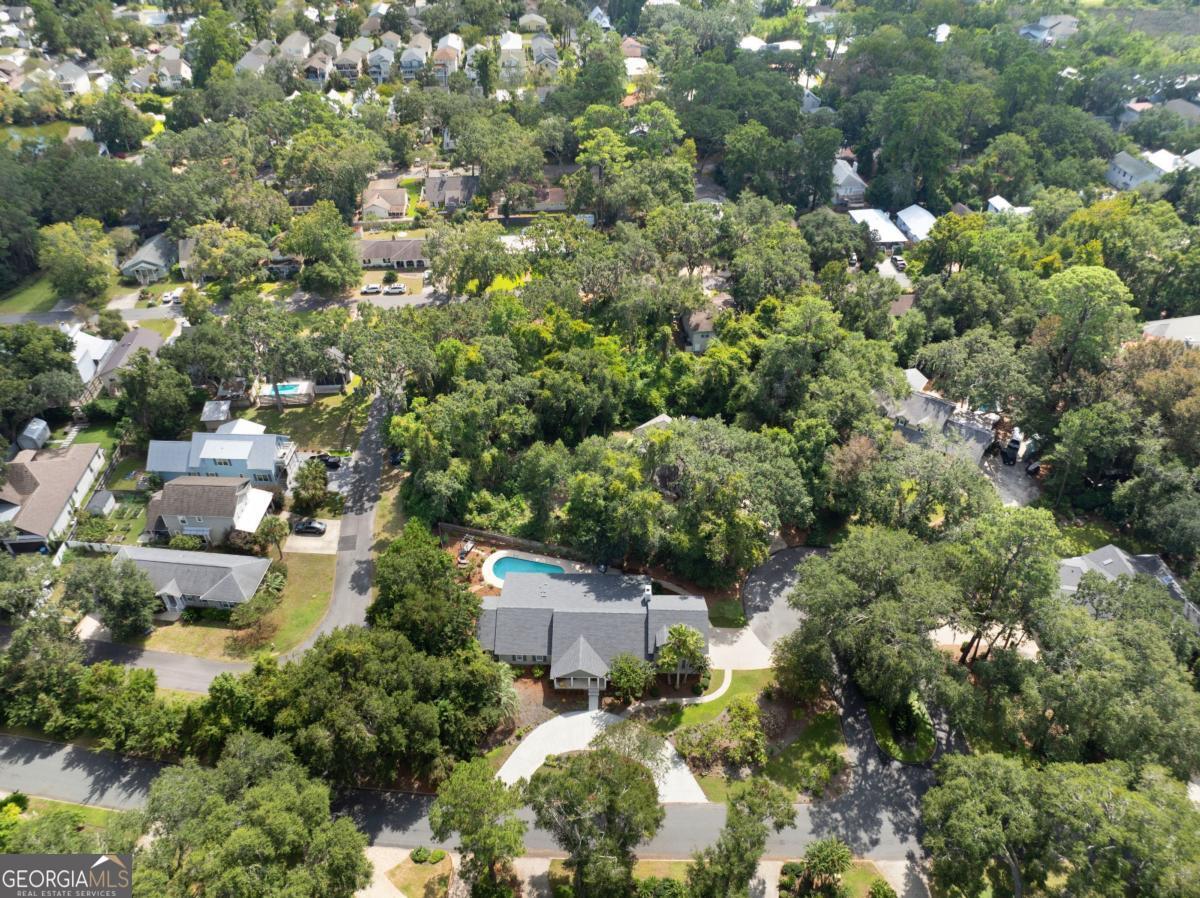 311 Dunbarton Drive St. Simons, GA 31522 - Photo 43 of 44 an aerial view of residential houses with outdoor space and trees