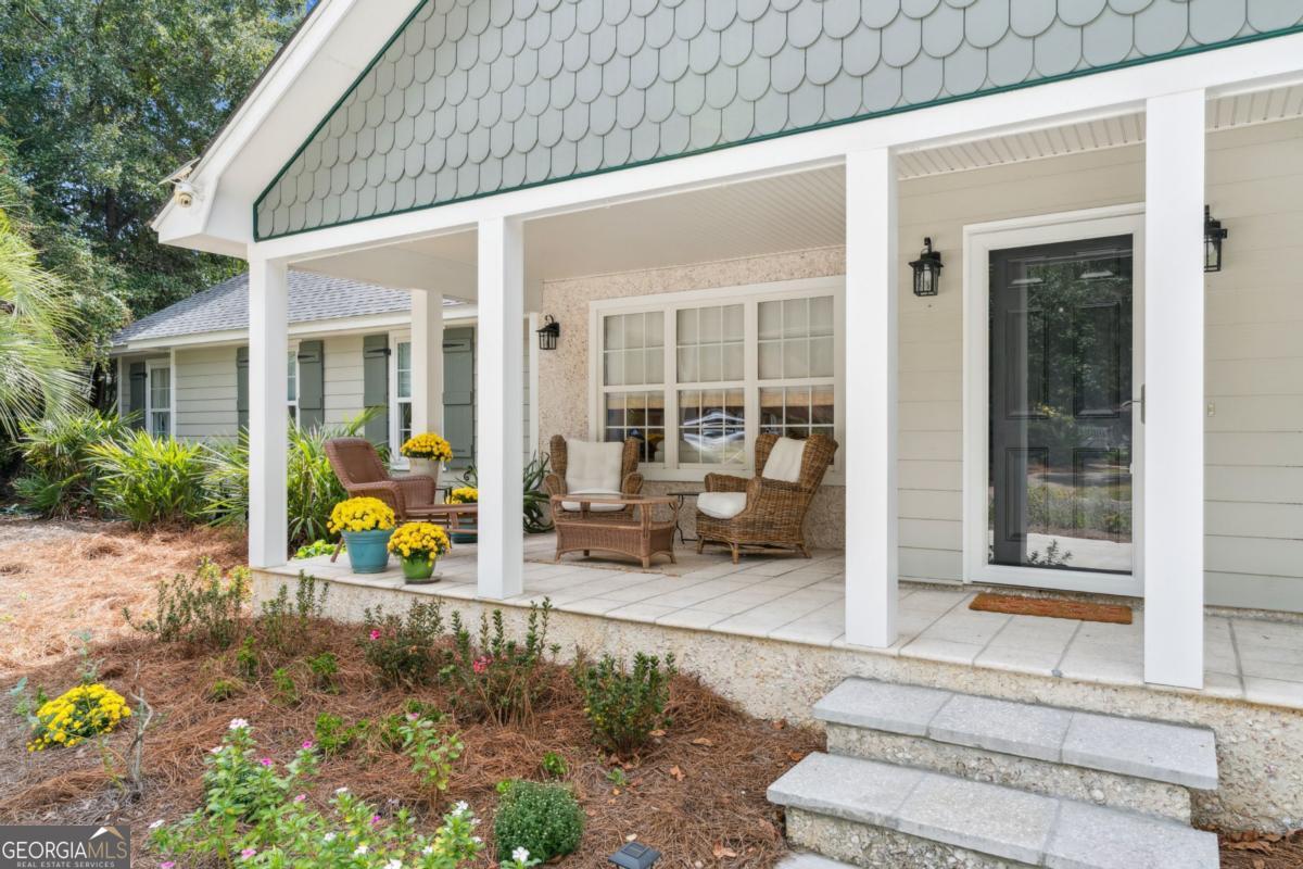 311 Dunbarton Drive St. Simons, GA 31522 - Photo 8 of 44 a view of house with outdoor seating space