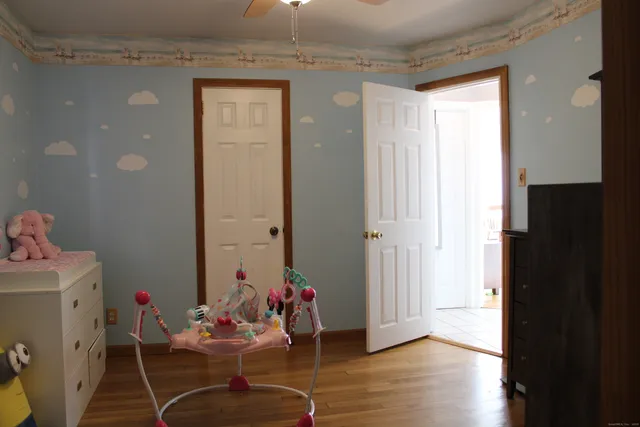 a room with furniture and wooden floor