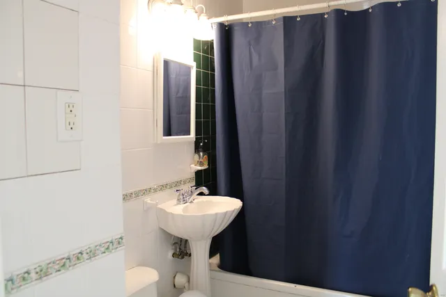 a bathroom with a sink and mirror