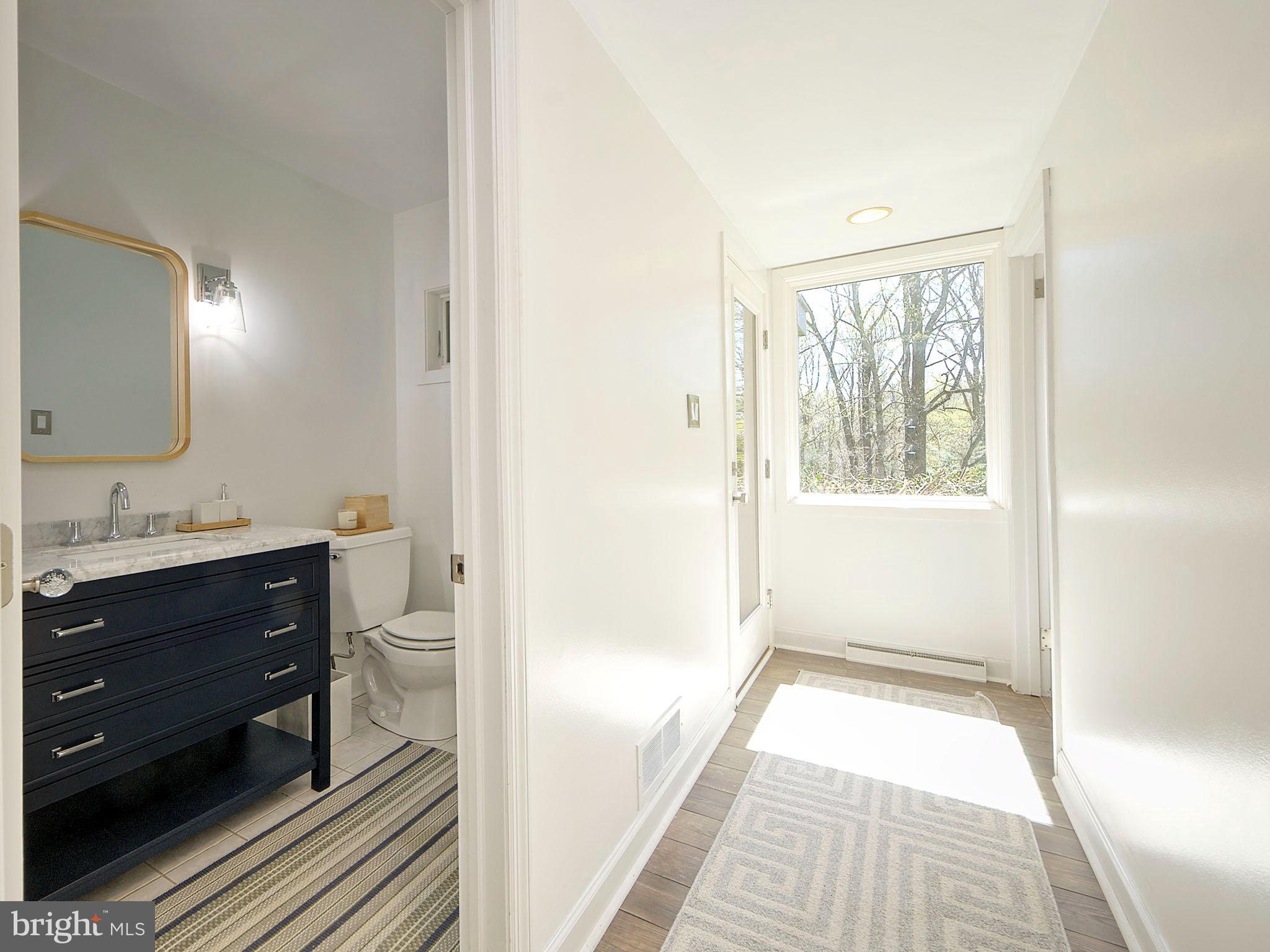 112 South Spring Valley Road Wilmington, DE 19807 - Photo 27 of 37 a bathroom with a sink and a mirror