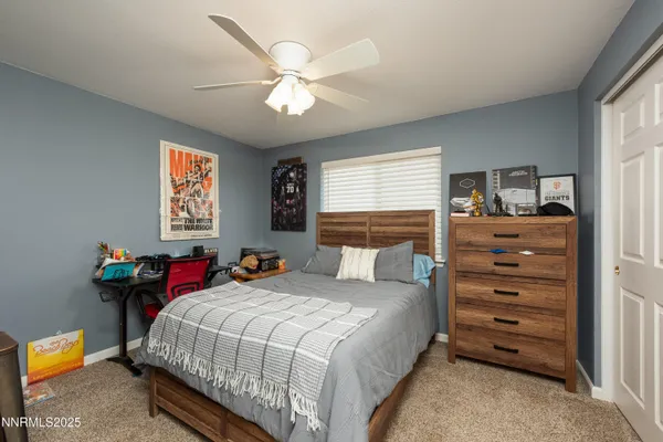 a bedroom with bed and window