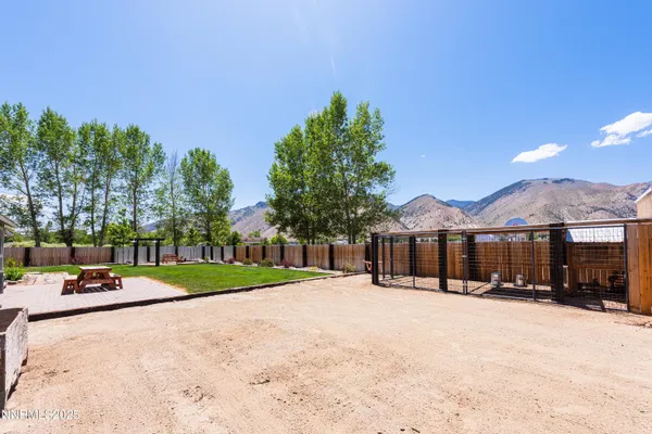 a view of house with yard and entertaining space