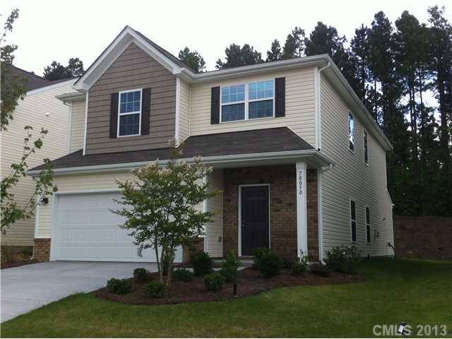78050 Rillstone Drive Lancaster, SC 29720 - Photo 1 of 14 a front view of a house with a yard and garage