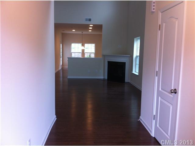 78050 Rillstone Drive Lancaster, SC 29720 - Photo 3 of 14 view of a livingroom with wooden floor and a fireplace