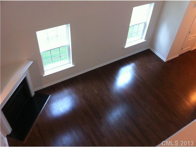 78050 Rillstone Drive Lancaster, SC 29720 - Photo 7 of 14 an empty room with wooden floor and windows