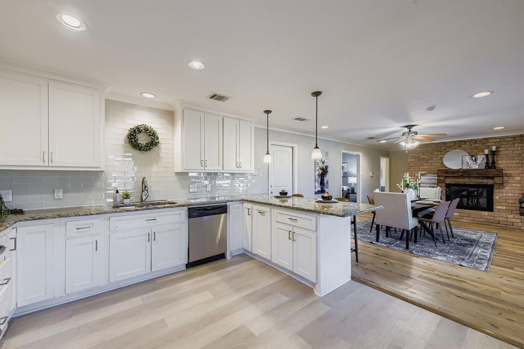 2801 Fairbrook Street Irving, TX 75062 - Photo 12 of 23 a large kitchen with lots of counter and chairs