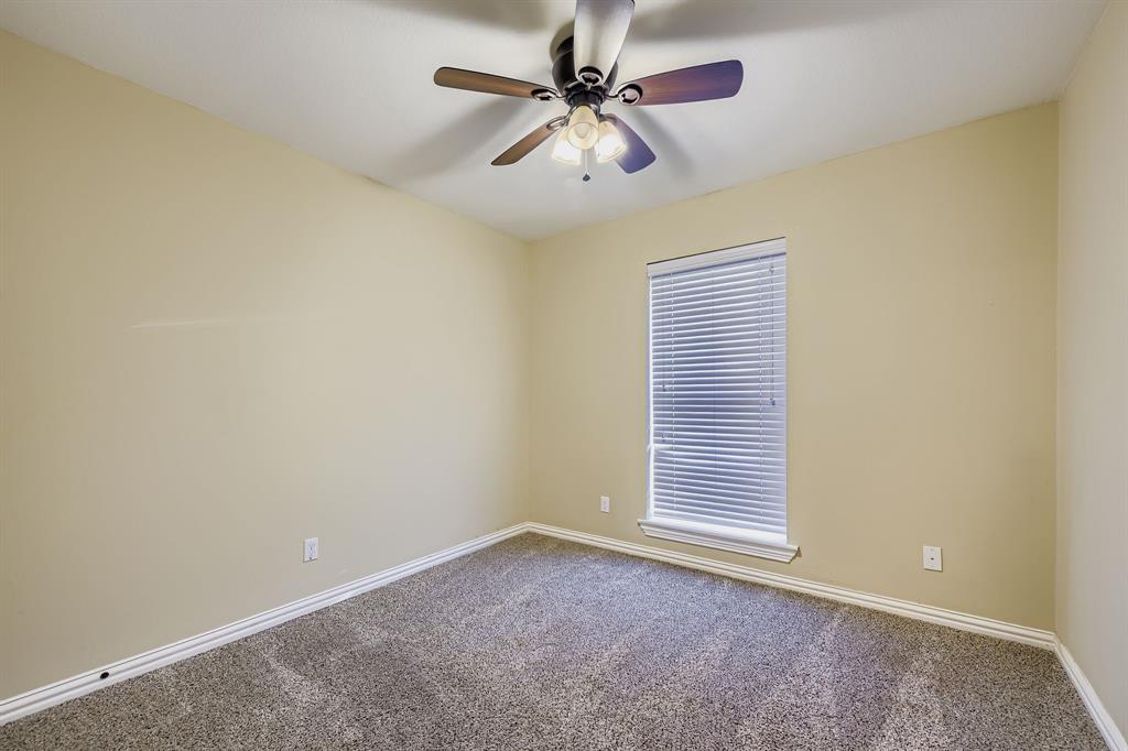2801 Fairbrook Street Irving, TX 75062 - Photo 17 of 23 a view of a livingroom with a ceiling fan and window