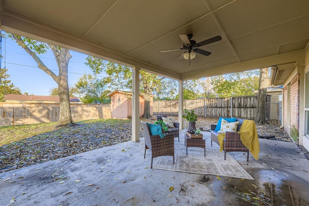 2801 Fairbrook Street Irving, TX 75062 - Photo 20 of 23 a patio with yard glass top table and chairs