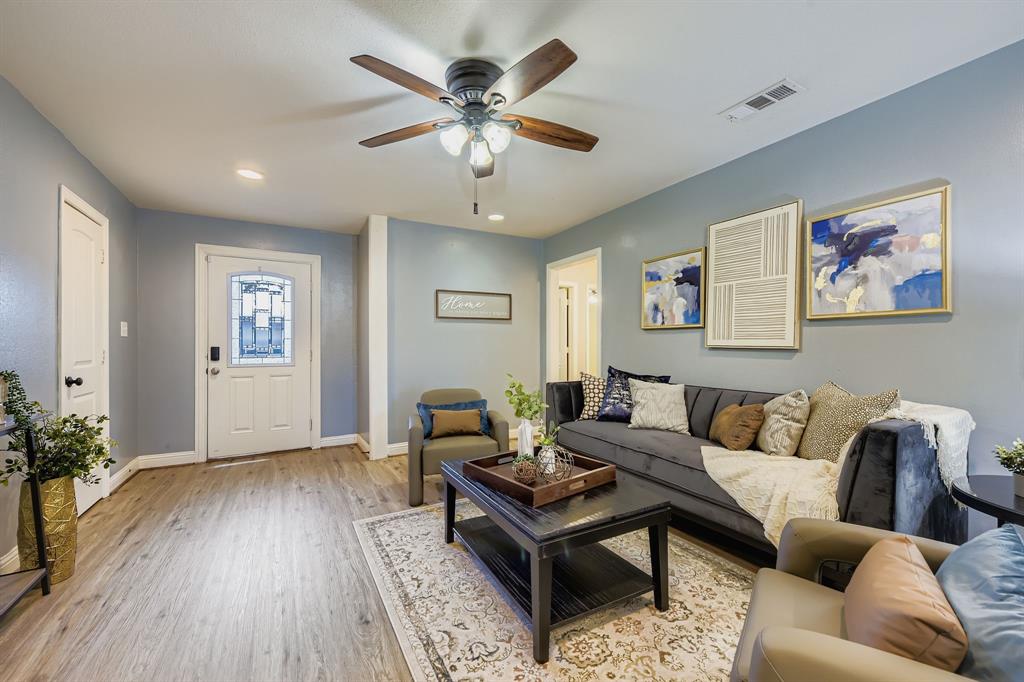 2801 Fairbrook Street Irving, TX 75062 - Photo 2 of 23 a living room with furniture and wooden floor