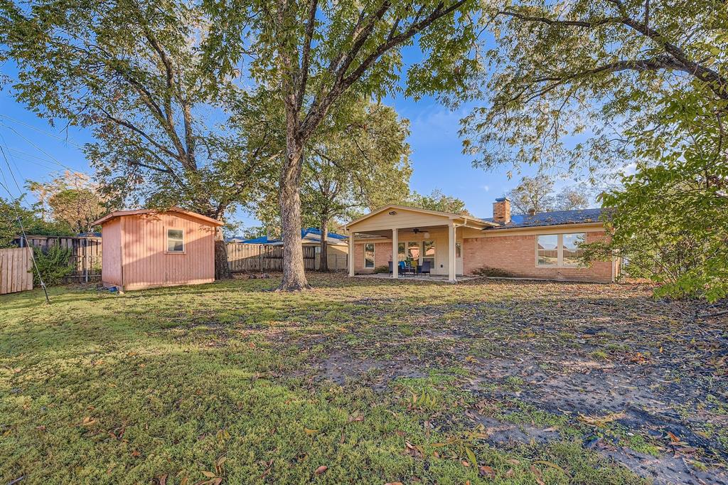 2801 Fairbrook Street Irving, TX 75062 - Photo 21 of 23 a front view of a house with a yard