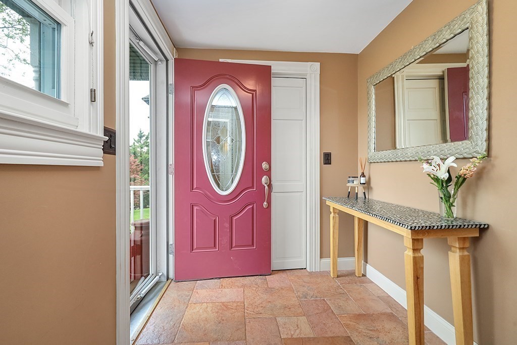 20 Maple Avenue Upton, MA 01568 - Photo 11 of 42 a view of a hallway with mirror on the walls