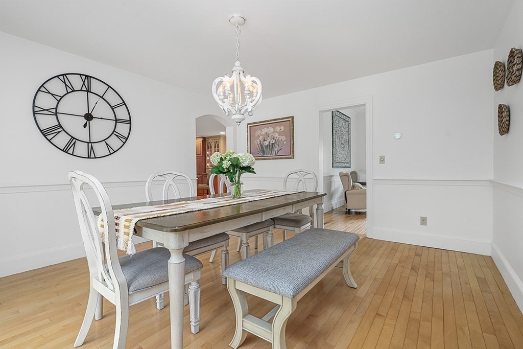20 Maple Avenue Upton, MA 01568 - Photo 13 of 42 a view of a dining room with furniture and a chandelier