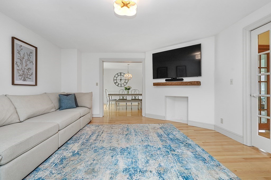 20 Maple Avenue Upton, MA 01568 - Photo 15 of 42 a living room with a flat screen tv and a couch