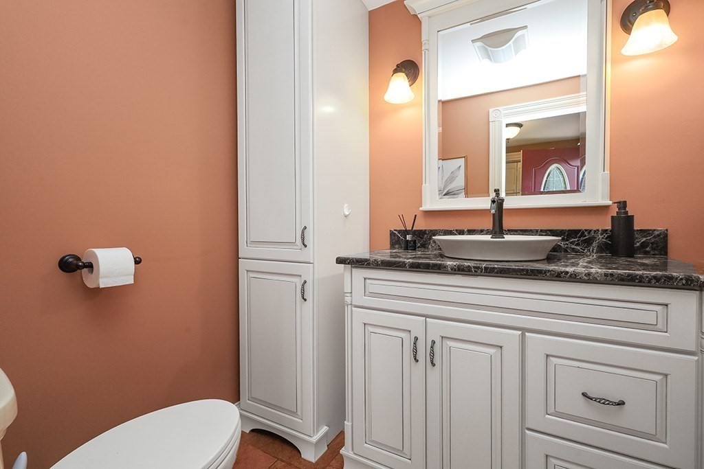 20 Maple Avenue Upton, MA 01568 - Photo 17 of 42 a bathroom with a granite countertop toilet sink and mirror