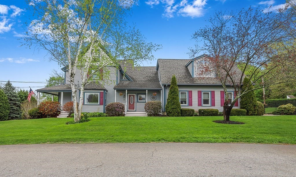 20 Maple Avenue Upton, MA 01568 - Photo 2 of 42 front view of a brick house with a yard