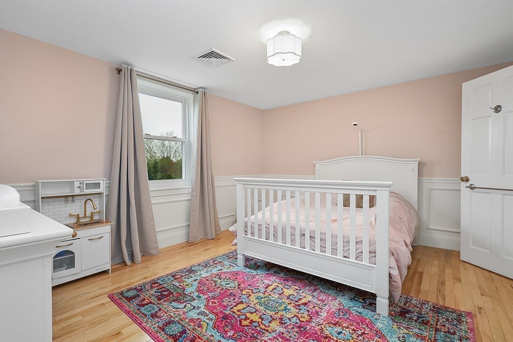 20 Maple Avenue Upton, MA 01568 - Photo 23 of 42 a view of a bedroom with wooden floor and a window