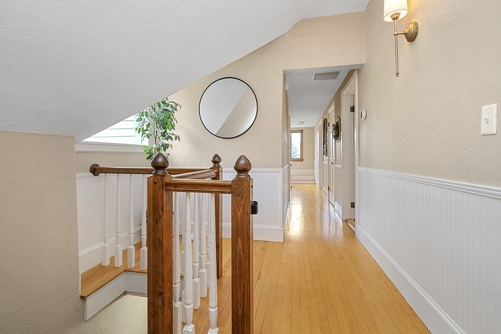 20 Maple Avenue Upton, MA 01568 - Photo 28 of 42 a view of a hallway with wooden floor and front door