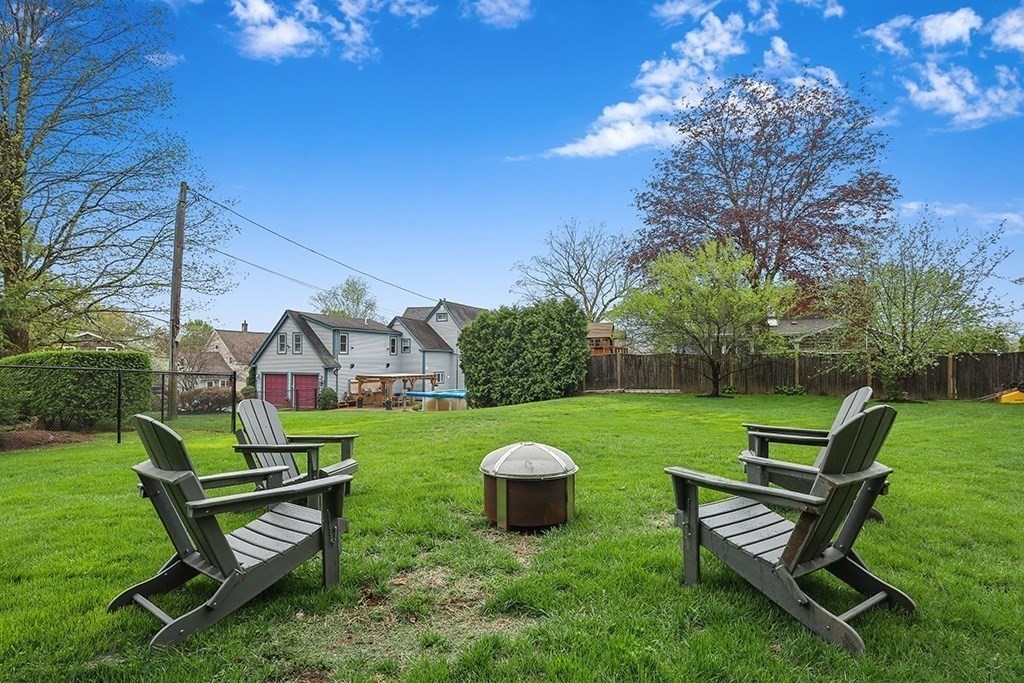 20 Maple Avenue Upton, MA 01568 - Photo 39 of 42 a view of a bench in the garden near a house