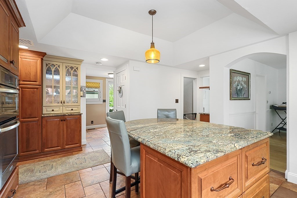 20 Maple Avenue Upton, MA 01568 - Photo 10 of 42 a kitchen with granite countertop sink and refrigerator