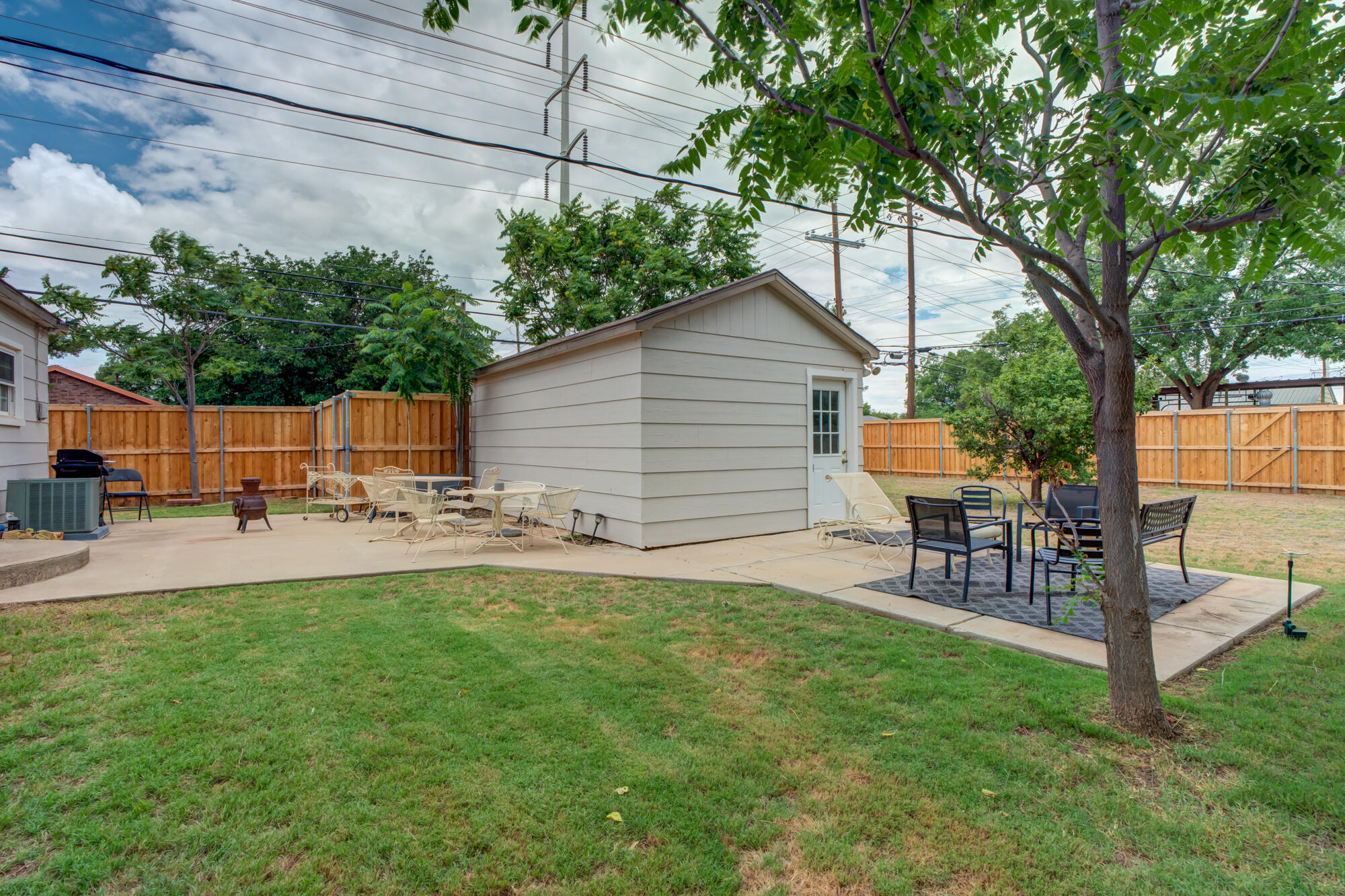 2826 33rd Street Lubbock, TX 79410 - Photo 29 of 33 a view of a backyard with sitting area