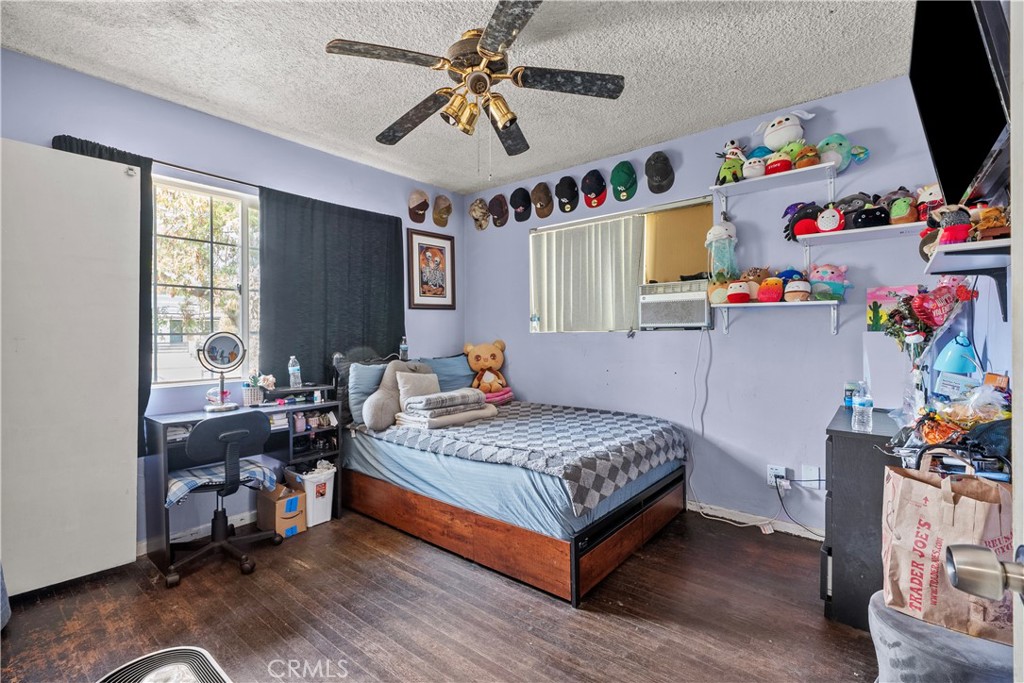 14930 Hubbard Street Sylmar, CA 91342 - Photo 18 of 22 a bedroom with a bed and a window