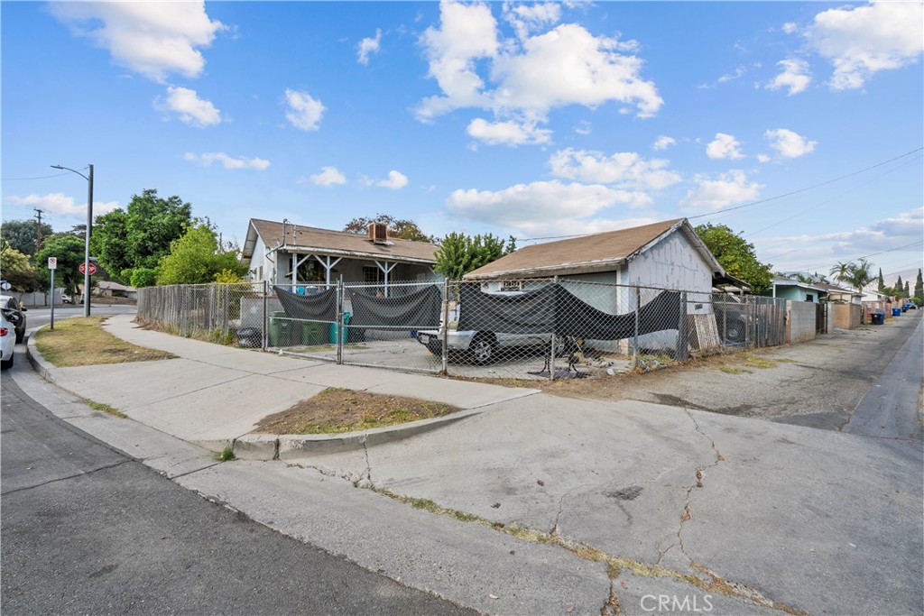 14930 Hubbard Street Sylmar, CA 91342 - Photo 3 of 22 a swimming pool with outdoor seating and yard in the back