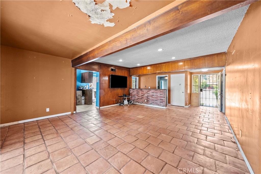 14930 Hubbard Street Sylmar, CA 91342 - Photo 8 of 22 a view of a hallway with closet and a large window