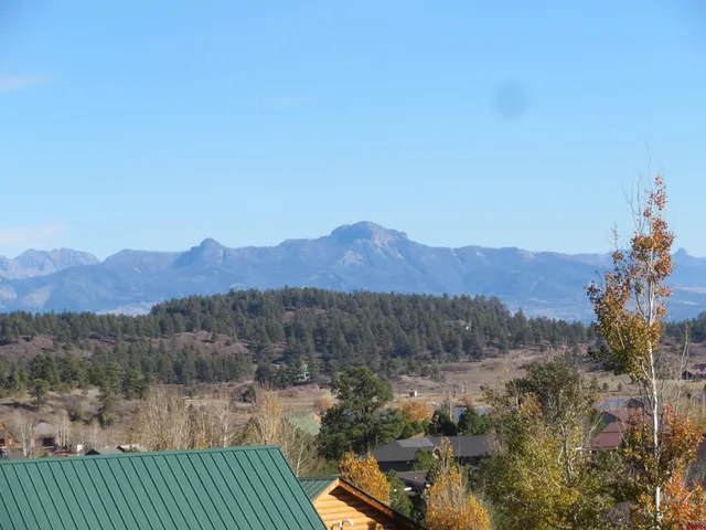 a view of a town with mountains in the background