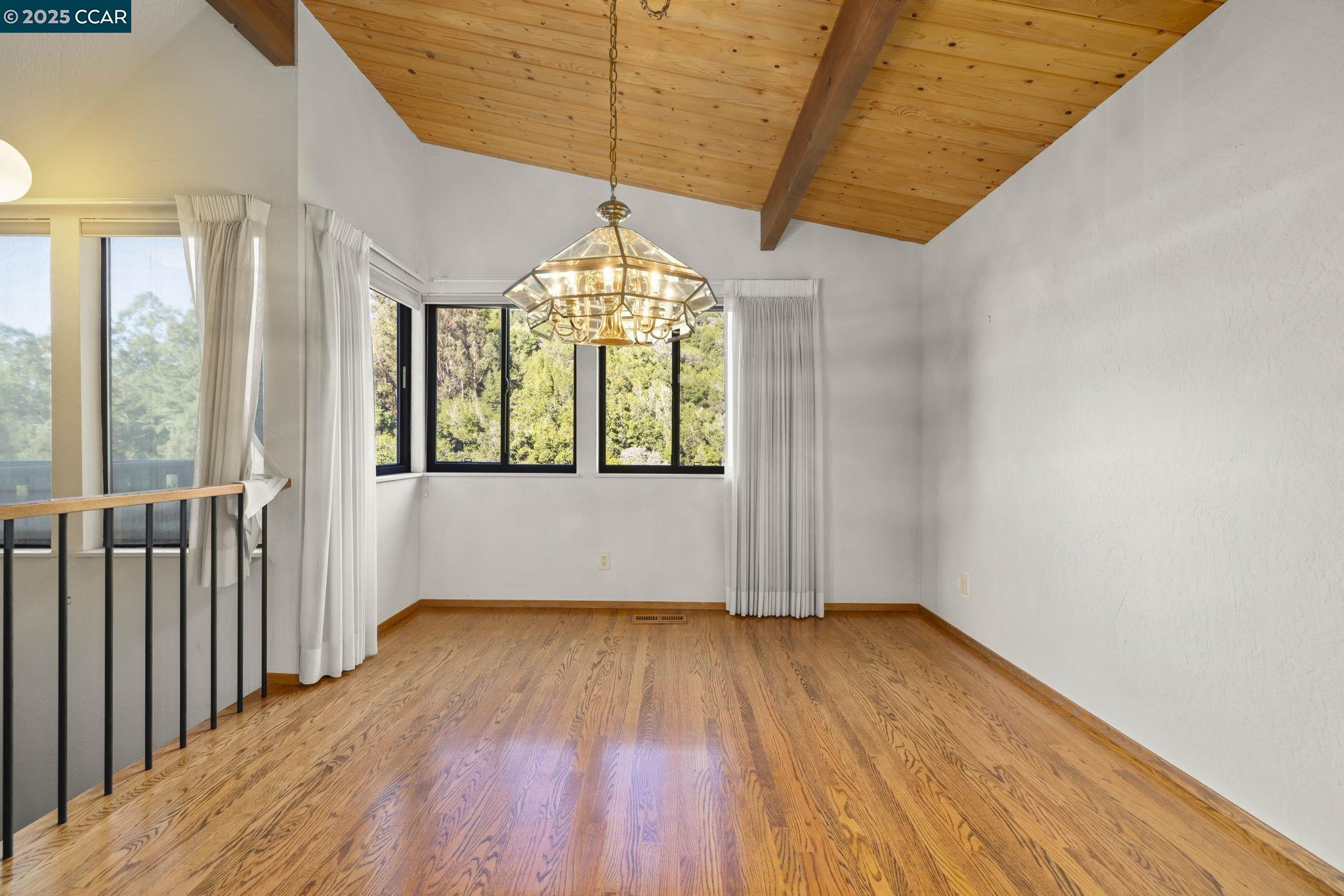 1383 Alvarado Road Berkeley, CA 94705 - Photo 11 of 47 a view of hallway with stairs and wooden floor