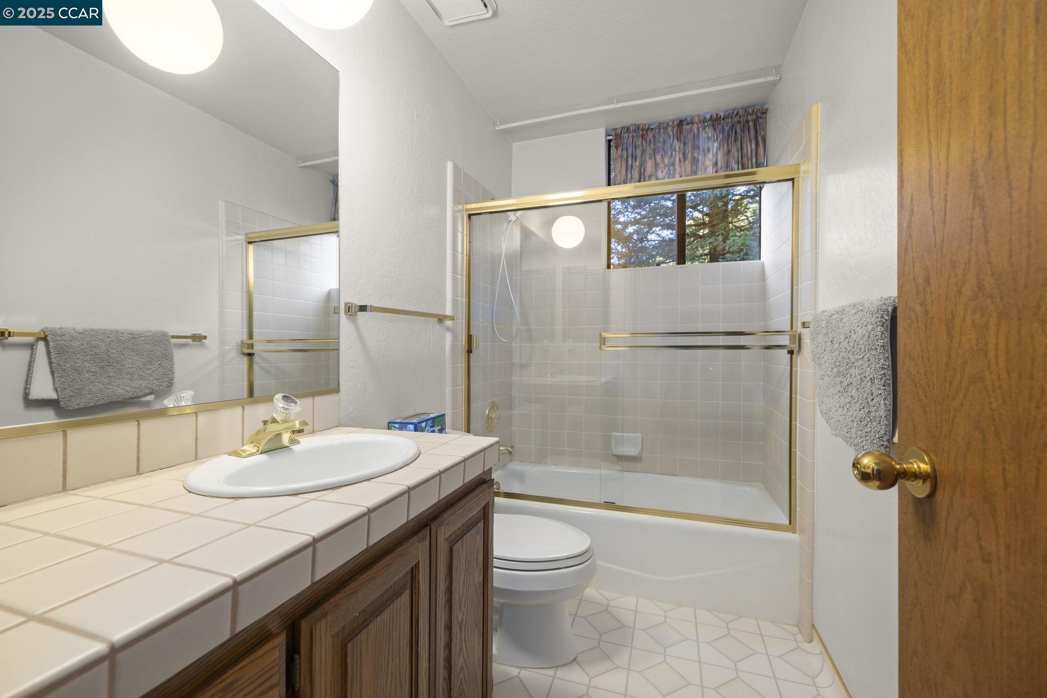 1383 Alvarado Road Berkeley, CA 94705 - Photo 26 of 47 a bathroom with a sink a toilet and shower