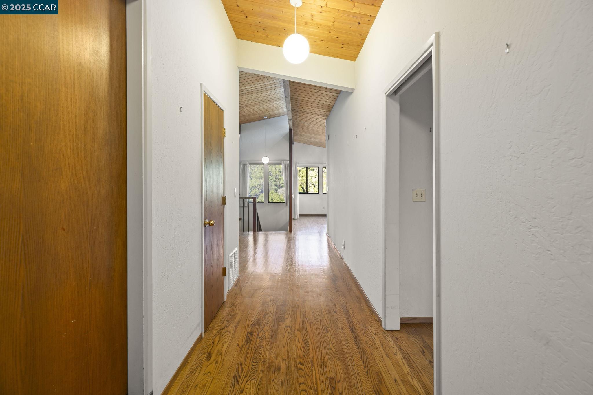 1383 Alvarado Road Berkeley, CA 94705 - Photo 6 of 47 a view of a hallway with wooden floor