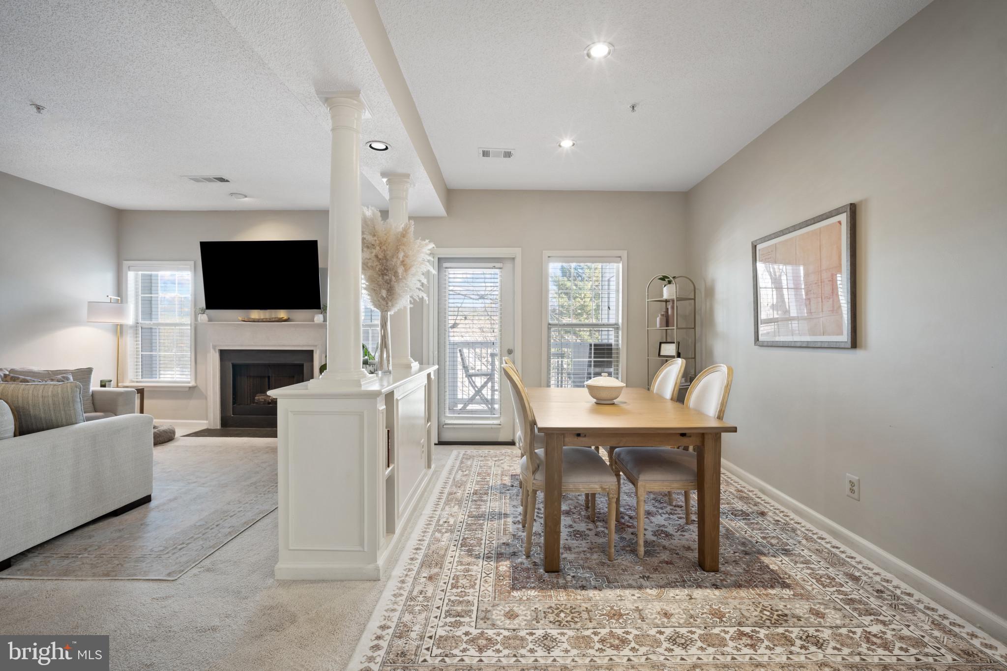 1724 Lake Shore Crest Drive, Unit 25 Reston, VA 20190 - Photo 12 of 52 a work room with furniture a fireplace and a flat screen tv