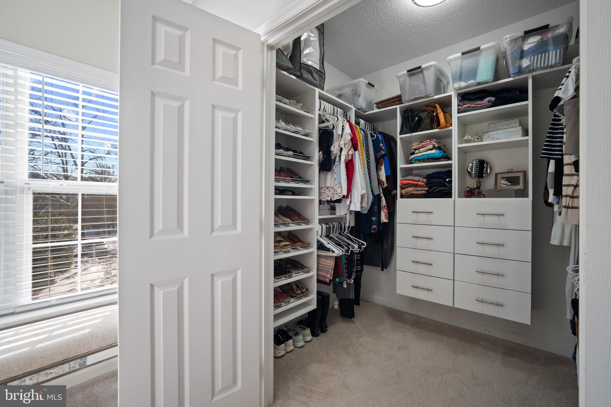 1724 Lake Shore Crest Drive, Unit 25 Reston, VA 20190 - Photo 22 of 52 a view of walk in closet with clothes