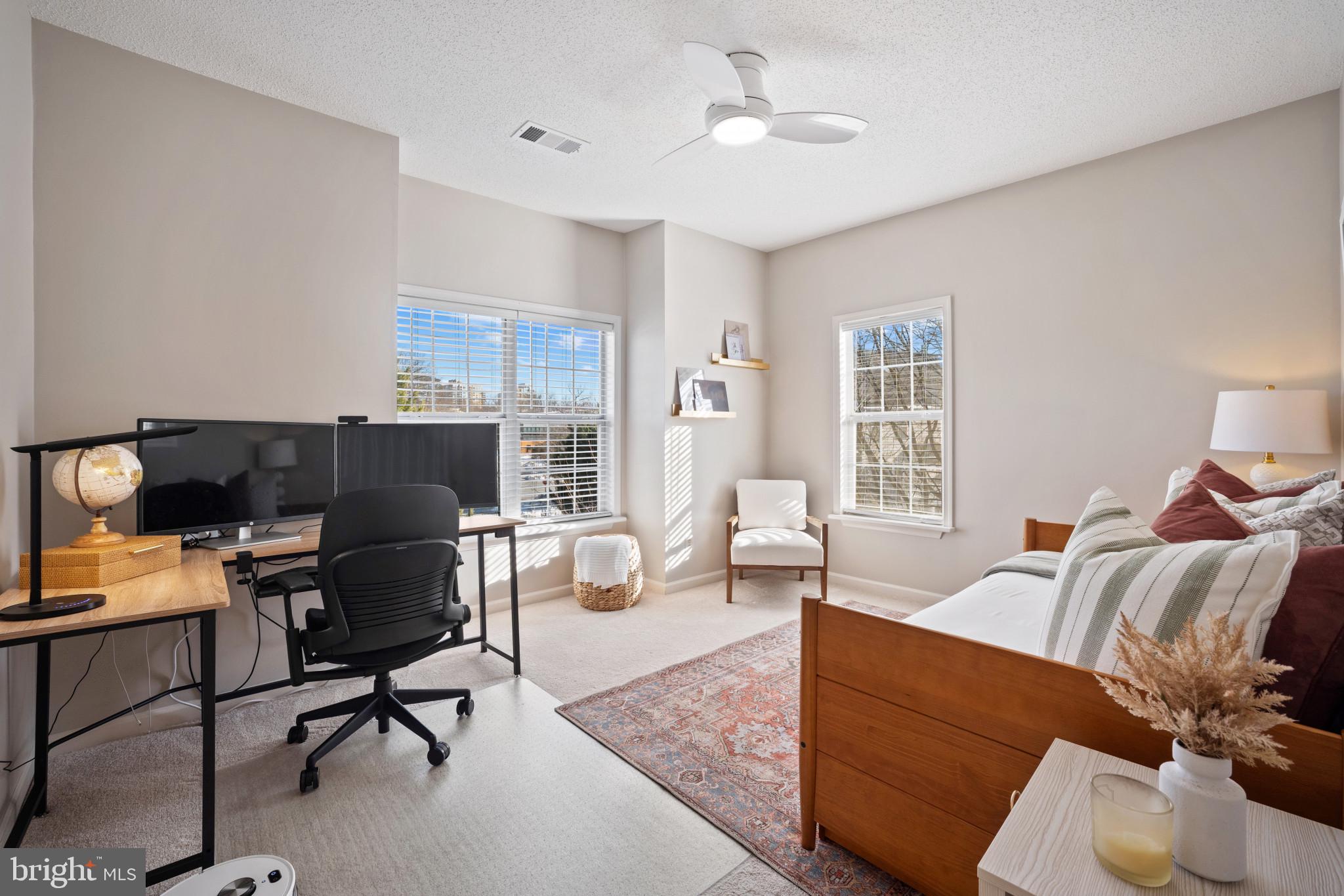 1724 Lake Shore Crest Drive, Unit 25 Reston, VA 20190 - Photo 26 of 52 a living room with furniture and a window