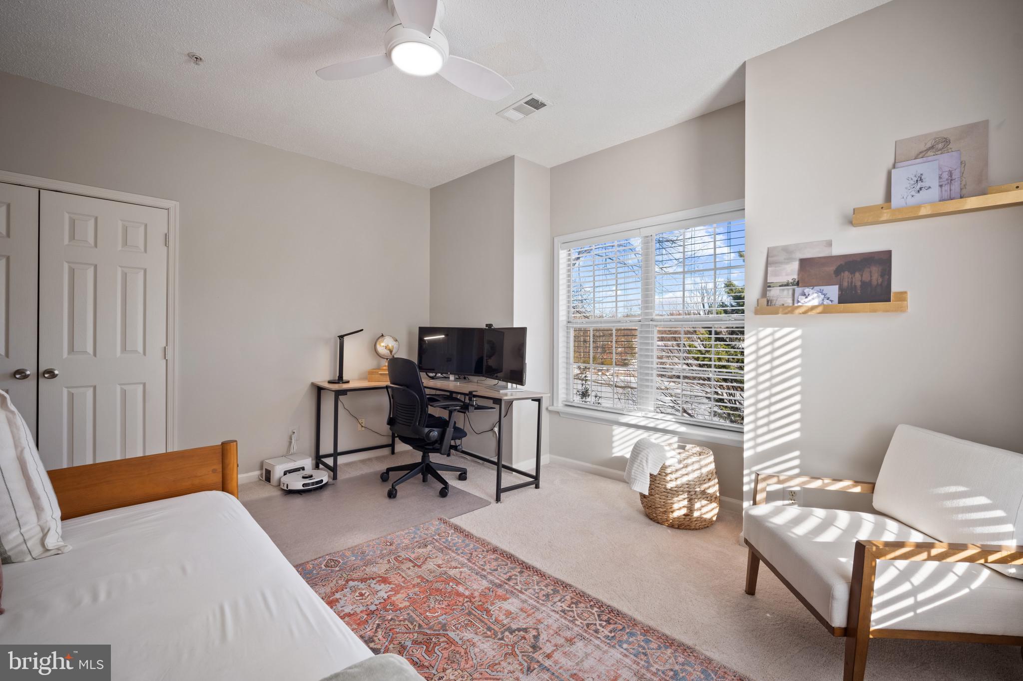 1724 Lake Shore Crest Drive, Unit 25 Reston, VA 20190 - Photo 27 of 52 a bedroom with furniture and a window