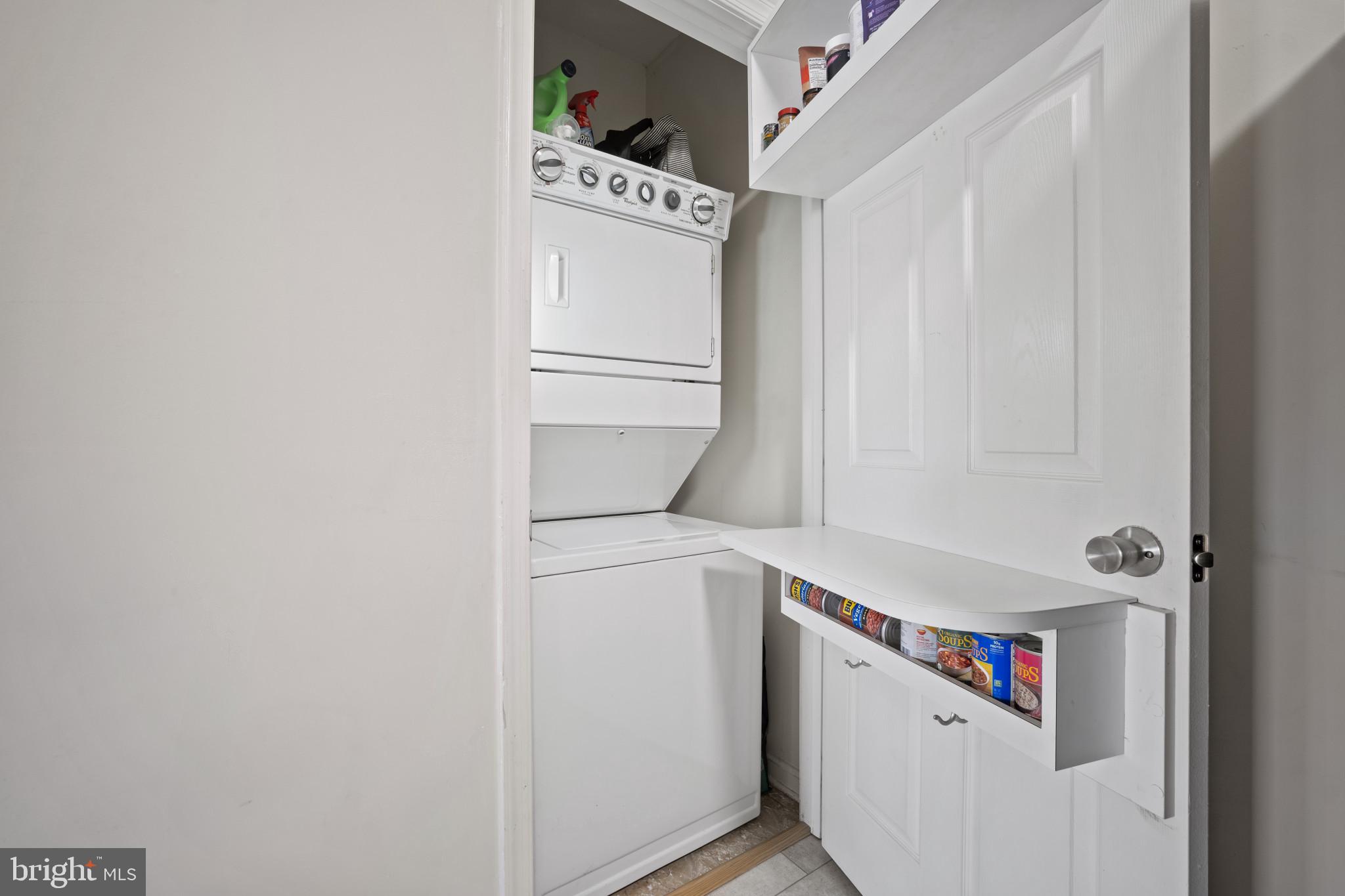 1724 Lake Shore Crest Drive, Unit 25 Reston, VA 20190 - Photo 29 of 52 a utility room with dryer and washer