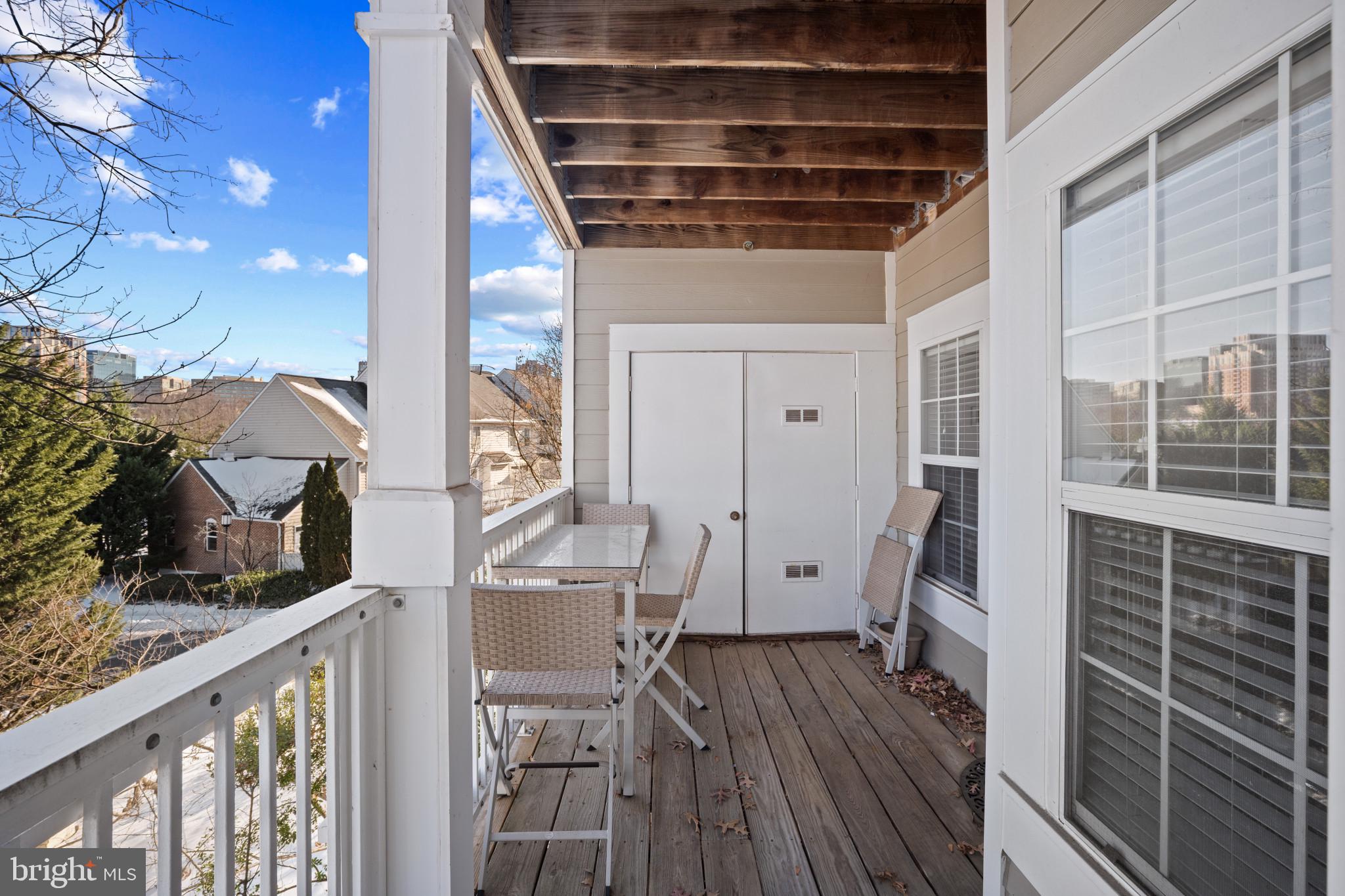 1724 Lake Shore Crest Drive, Unit 25 Reston, VA 20190 - Photo 35 of 52 a view of a balcony with chairs and wooden floor