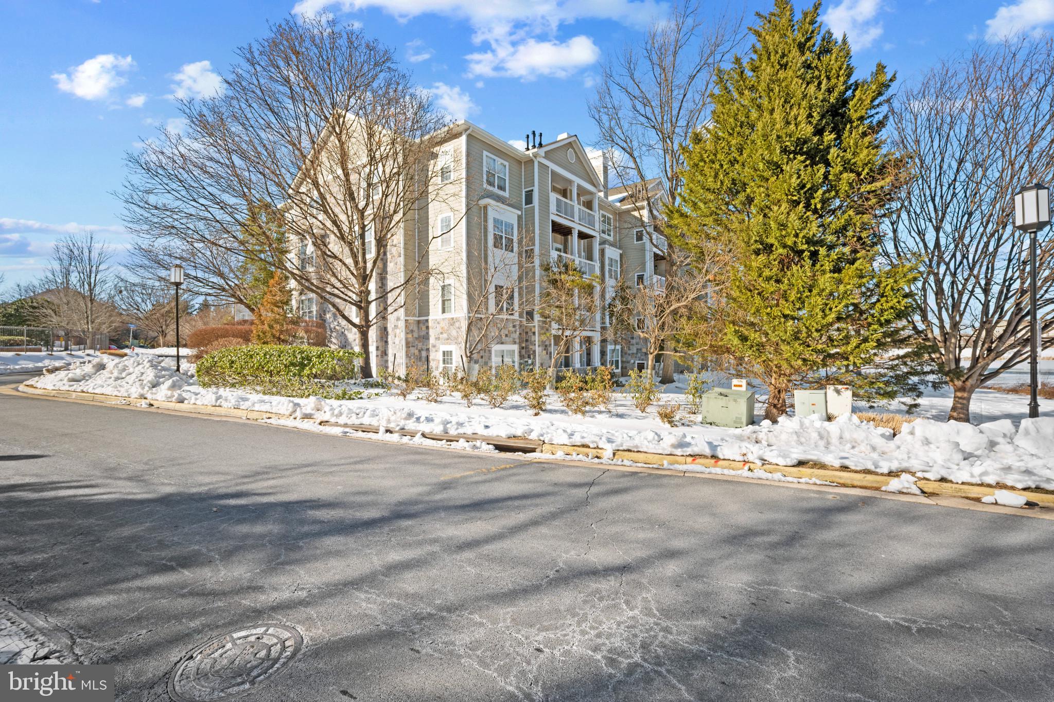 1724 Lake Shore Crest Drive, Unit 25 Reston, VA 20190 - Photo 49 of 52 a view of a building with a snow