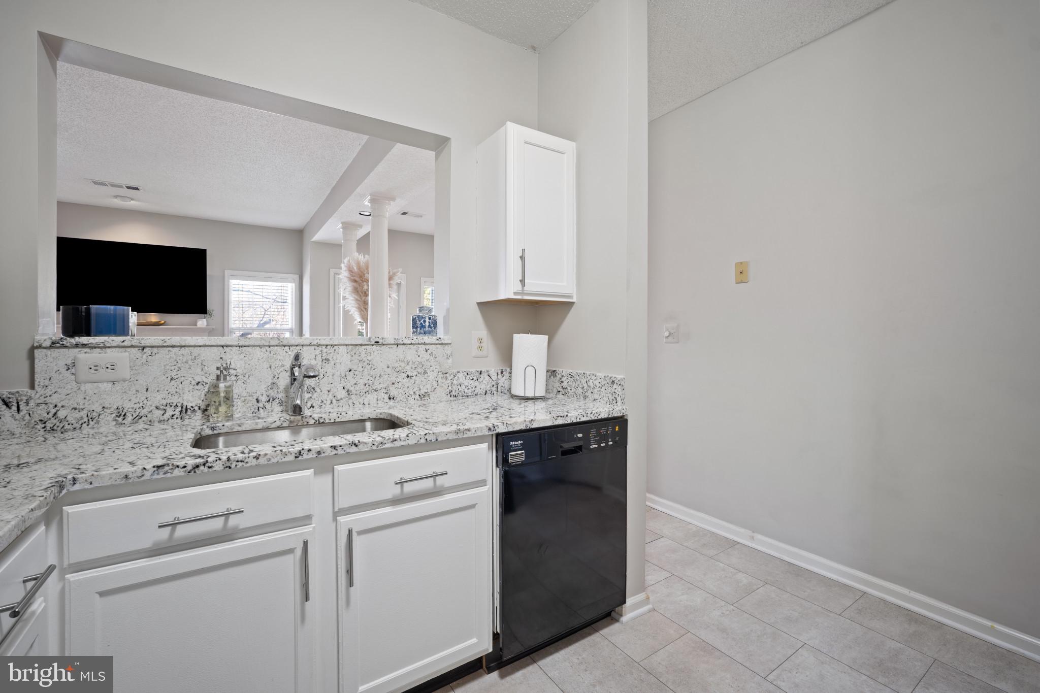 1724 Lake Shore Crest Drive, Unit 25 Reston, VA 20190 - Photo 7 of 52 a bathroom with a sink and a mirror