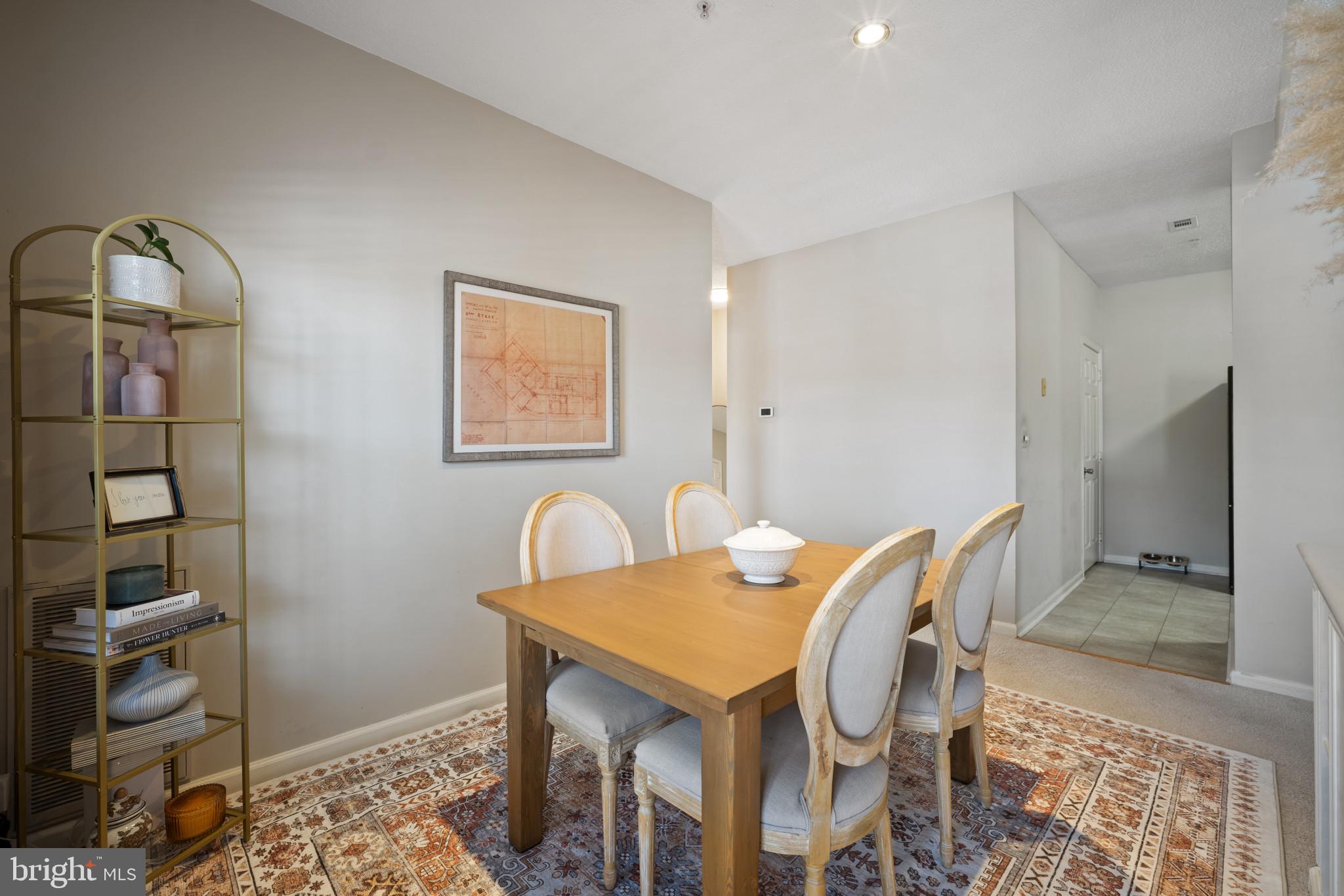 1724 Lake Shore Crest Drive, Unit 25 Reston, VA 20190 - Photo 10 of 52 a view of a dining room with furniture