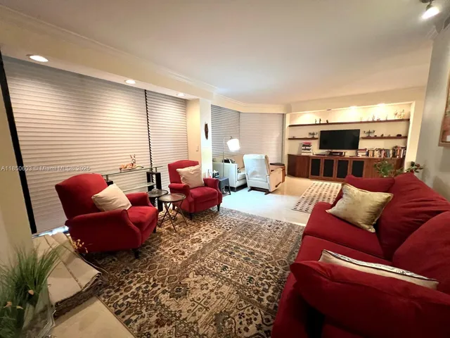 a living room with furniture a rug and a wooden floor