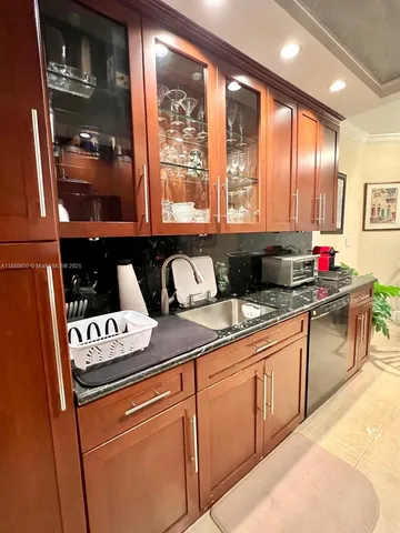 a view of a dining room with furniture and a potted plant