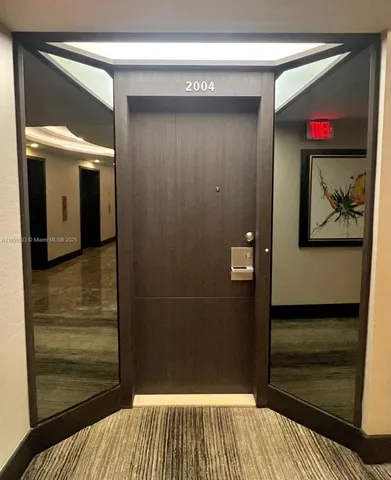 a view of a living room with a fireplace