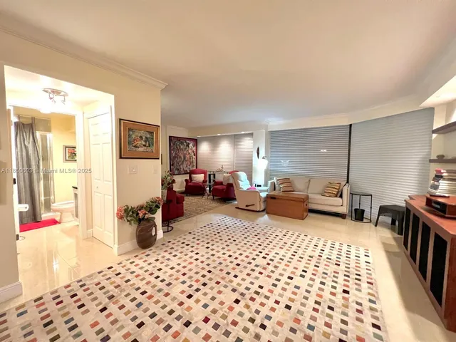 a bedroom with furniture and flat screen tv