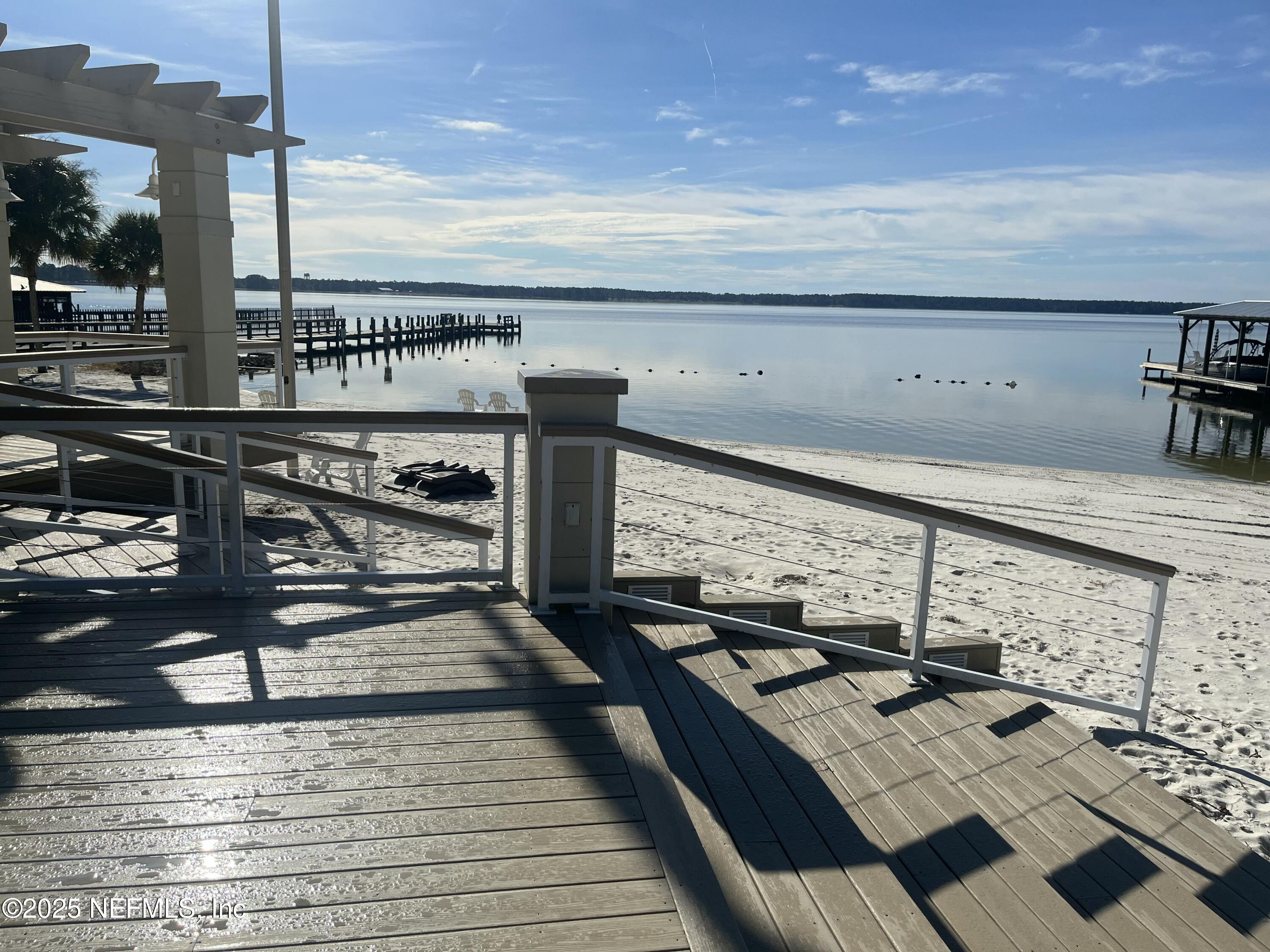 6486 Cabana Trace Starke, FL 32091 - Photo 16 of 16 a view of a balcony with furniture and wooden floor